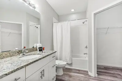 a bathroom with a sink and a toilet and a shower at Thematic 4 bdr near Disney-22101 in Kissimmee
