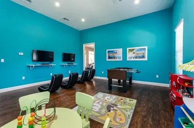 a childrens play room with a blue wall at Your Disney Vacation Home WL8932 in Kissimmee