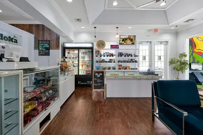 a grocery store with a counter and a blue chair at Your Disney Vacation Home 7102 in Kissimmee