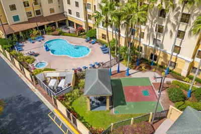 an aerial view of a swimming pool at a resort at Orlando 2BR Apt Full Kitchen Near Parks in Orlando