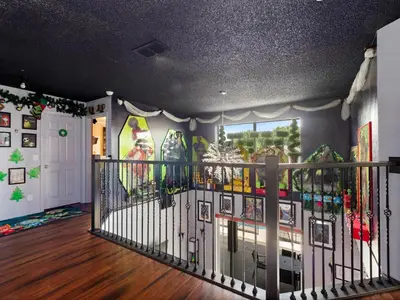 a room with a balcony with snowboards on the wall at bsv_villa8513 in Kissimmee