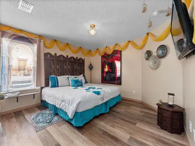 a bedroom with a bed with a banner on the wall at bsv_villa8513 in Kissimmee