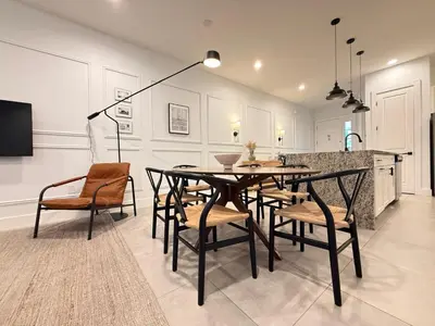 a dining room with a table and chairs at Magical 4BR Escape - Pet-Friendly, 9 Min to Disney in Orlando