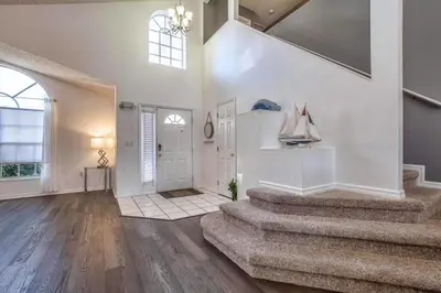 a large room with stairs and a white door at Waterfront Privacy On Disneys Doorstep, Spa!2101O in Orlando