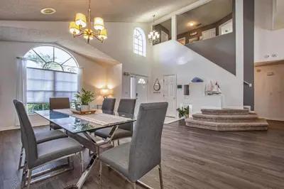 a dining room with a table and chairs at Waterfront Privacy On Disneys Doorstep, Spa!2101O in Orlando