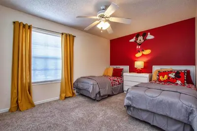 a bedroom with two beds and a ceiling fan at Waterfront Privacy On Disneys Doorstep, Spa!2101O in Orlando