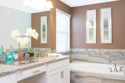 a bathroom with a tub and a sink at Rare!Lake Front Pool-Spa, Close To Clubhouse-1691C in Kissimmee