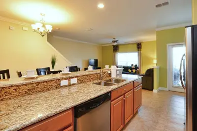 a kitchen with a sink and a counter top at Paradise Palms-5 Bed Townhome Wsplashpool-3045Pp in Kissimmee