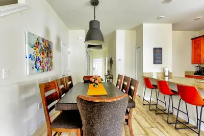 a dining room with a table and chairs at Bright Cheery Vacation Villa-1638St in Kissimmee