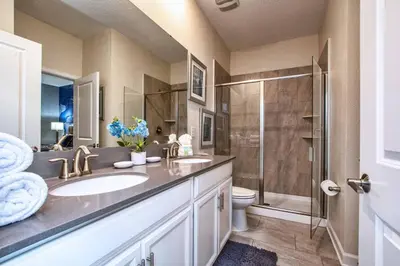 a bathroom with a sink and a shower at Luxury Home Close To Disney, Bbq, Spa-1690St in Kissimmee