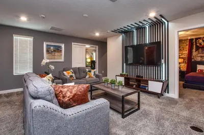 a living room with two couches and a flat screen tv at Luxury Home Close To Disney, Bbq, Spa-1690St in Kissimmee