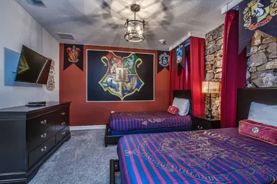 a bedroom with a bed and a dresser in it at Luxury Home Close To Disney, Bbq, Spa-1690St in Kissimmee
