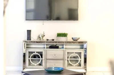 a silver entertainment center with two washing machines at Family Retreat W-Splashpool-1637St in Kissimmee