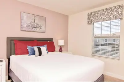 a bedroom with a white bed and a window at Family Retreat W-Splashpool-1637St in Kissimmee