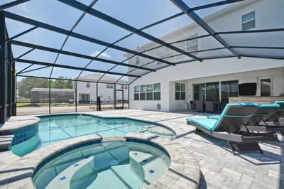 a large swimming pool with a glass roof at Sonoma - 6 Bedroom Pool Home- 1859Snr in Kissimmee