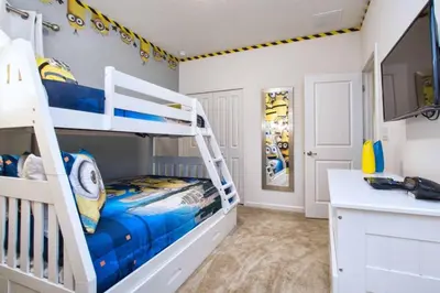 a bedroom with a bunk bed and a kitchen at Sonoma - 6 Bedroom Pool Home- 1859Snr in Kissimmee