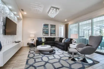 a living room with a couch and a tv at Sonoma - 6 Bedroom Pool Home- 1859Snr in Kissimmee