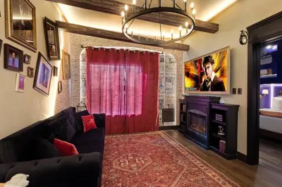 a living room with a couch and a red curtain at Apartment w 4 Beds Near I-Drive in Orlando