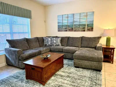 a living room with a couch and a coffee table at Dog Friendly Townhouse With Splashpool 3610Pp in Kissimmee