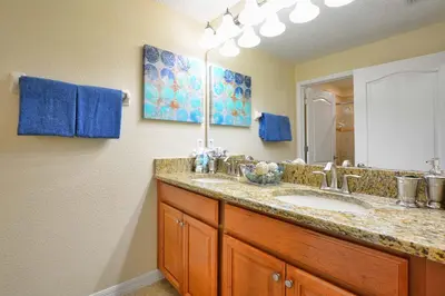 a bathroom with a sink and a mirror at Dog Friendly Townhouse With Splashpool 3610Pp in Kissimmee