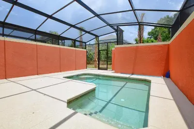 an indoor swimming pool with a glass roof at Dog Friendly Townhouse With Splashpool 3610Pp in Kissimmee
