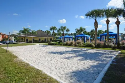 a pathway with blue gazebos and palm trees at Dog Friendly Townhouse With Splashpool 3610Pp in Kissimmee