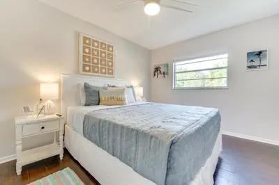 a white bedroom with a bed and a window at Private Outdoor Oasis with Pool Home in Longwood! in Orlando