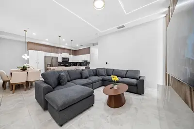 a living room with a couch and a table at Cozy Apartment 03 Bedrooms at Storey Lake Resort in Kissimmee
