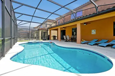 an indoor swimming pool with a glass roof at Disney Dream at Veranda Palms Resort in Kissimmee