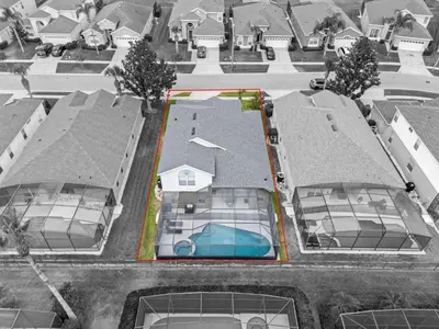an aerial view of a house with a swimming pool at *Sun Palm Paradise* | Sleeps 14 | Near Disney! in Kissimmee