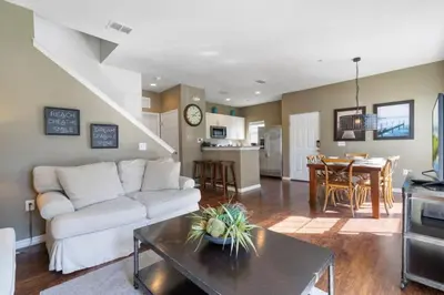 a living room with a white couch and a table at Outstanding 4 bdr near Disney 16108 in Kissimmee