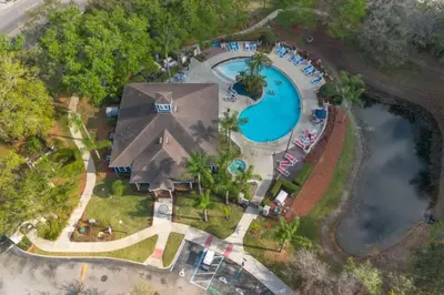 an overhead view of a swimming pool at a resort at Luxury 4BDR House close to Parks in Kissimmee