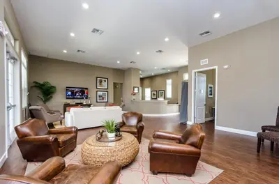 a living room with leather chairs and a table at 3BR Disney Escape for Families in Kissimmee