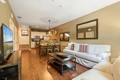 a living room with a couch and a table at 3BR Disney Escape for Families in Kissimmee