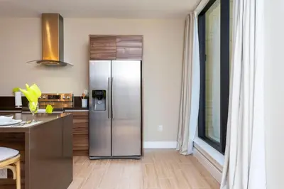 a kitchen with a stainless steel refrigerator at Luxury 3BDR House near Disney 7527 in Orlando