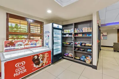 a store with a food counter in a store at Hotel Room Next to Universal At Stay Sky Suites in Orlando