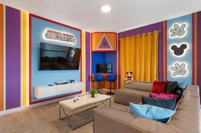 a living room with a couch and a table at Family 5BR Retreat w Pool Near Disney in Kissimmee