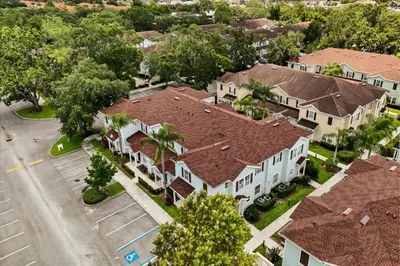 an overhead view of a residential neighborhood with houses at 4 Bedrooms 3 Bathrooms Lucaya Village 19-104 in Kissimmee