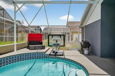 a swimming pool on the roof of a house at Entire Disney Retreat Home minutes from Disney, Shopping, and Restaurants 4br,2ba,7beds sleeps 10 in Orlando