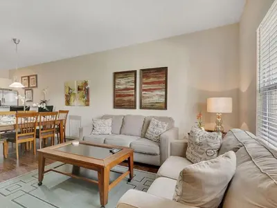 a living room with a couch and a table at Your Home near Disney 19106 in Kissimmee