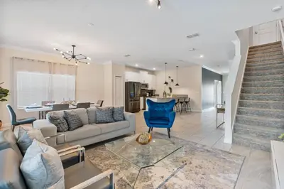 a living room with a couch and a table at Outstanding 5BDR Disney Vacation in Kissimmee