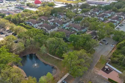 an aerial view of a neighborhood with a pond at Luxury 4 BDR House near Disney 11105 in Kissimmee