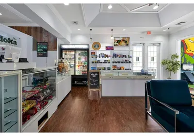 a grocery store with a counter and a blue chair at Amazing 4 bdr house near Disney 16101 in Kissimmee