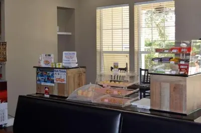 a bakery with a counter with food on it at Amazing 4bdr house in Disney 20104 in Kissimmee