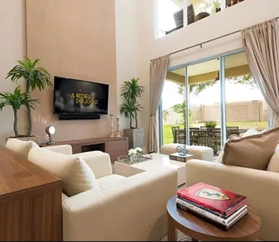 a living room with white furniture and a flat screen tv at Super Close to Disney Magic Stays in Orlando