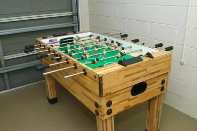 a foosball table in a room with at Family Escape Close to parks in Orlando