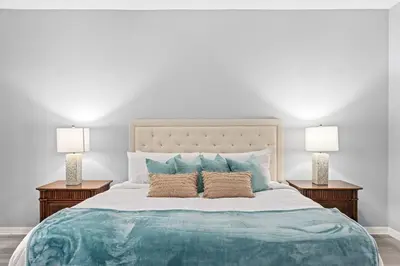 a bedroom with a large bed with two lamps at Finding Nemo House at Caribe Cove Resort - Sage Vacations in Kissimmee