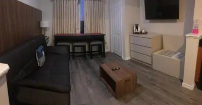 a living room with a couch and a table at Universal-Disney Dream 606H Studio - The Point in Orlando