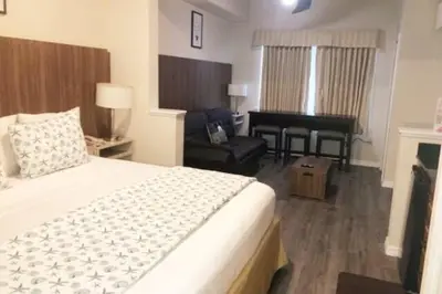 a hotel room with a bed and a piano at Universal-Disney Dream 606H Studio - The Point in Orlando