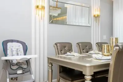a dining room with a table and chairs at 4 Bedrooms3 Bathrooms at Storey Lake Resort in Kissimmee